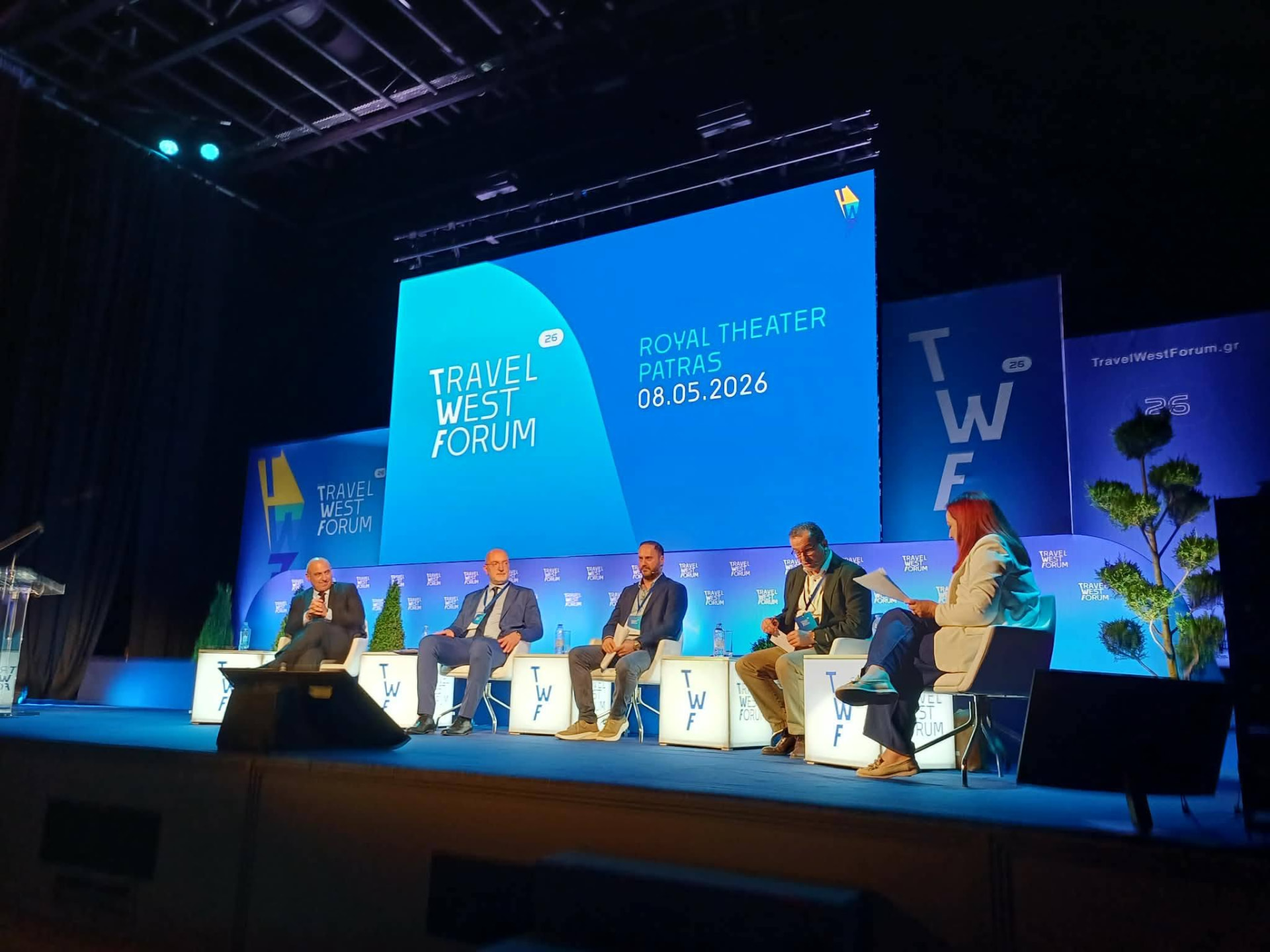 Panel discussion on stage at the Travel West Forum, Royal Theater Patras